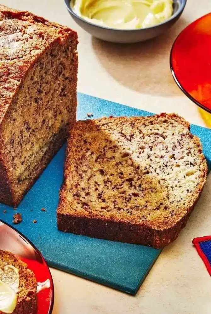 Freshly baked simple banana bread on a wooden cutting board