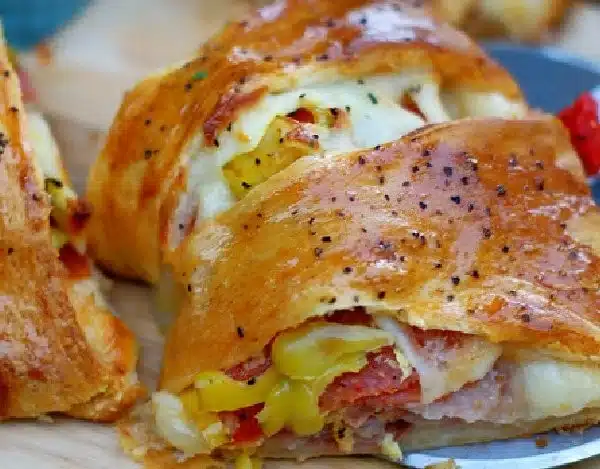 Spicy Italian Crescent Ring served on a plate with herbs and spices