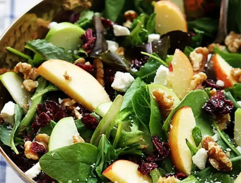 Fresh Apple Cranberry Walnut Salad with nuts and fruits in a bowl