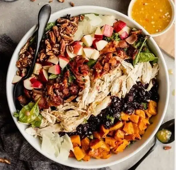 Autumn Cobb Salad topped with Maple Vinaigrette, featuring seasonal ingredients.