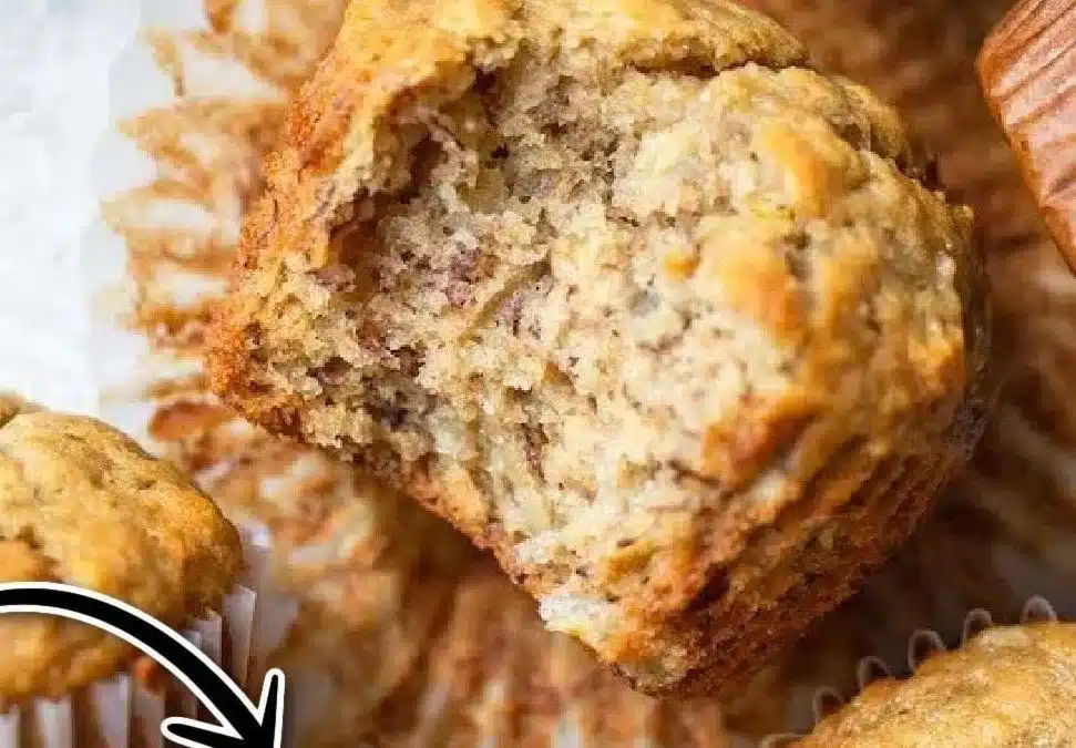 Baked banana muffins on a wooden serving platter, showcasing a delicious treat.