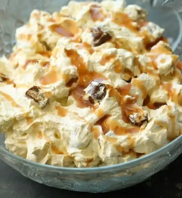 Delicious Caramel Apple Jell-O Salad served in a bowl with caramel drizzle