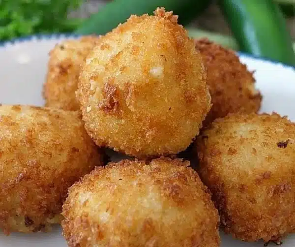 Crispy fried mashed potato bites served on a plate