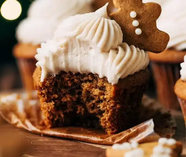 Delicious gingerbread cupcakes with cinnamon buttercream frosting on a plate