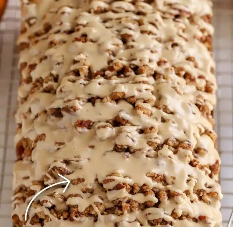 Freshly baked maple pumpkin bread with a golden crust and autumn spices