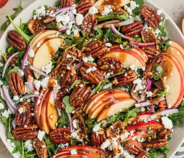Simple Apple Arugula Salad served in a bowl with fresh ingredients.