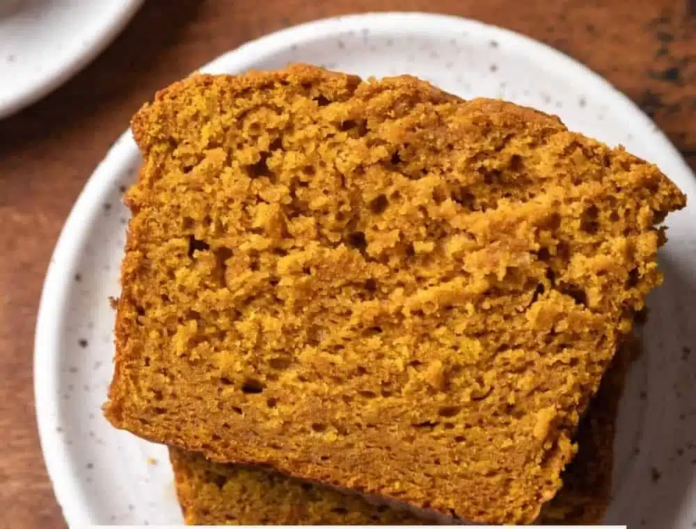 Deliciously moist Sour Cream Pumpkin Bread slice with fall spices.