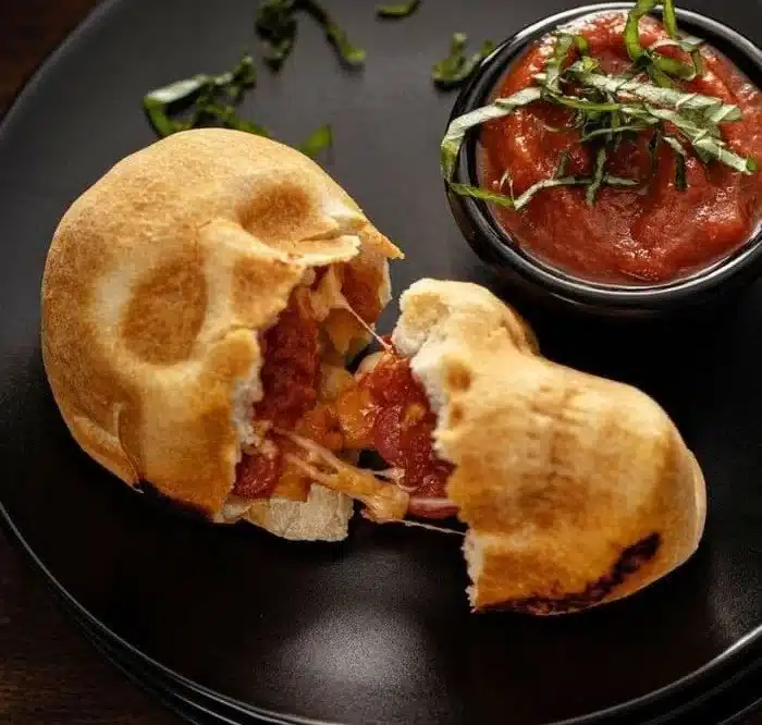 Spooky pizza skulls Halloween recipe featuring delicious toppings