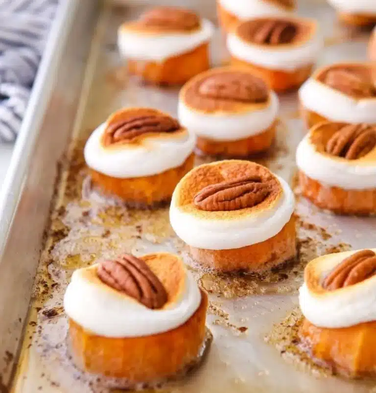 Sweet potato bites with pecans and marshmallows served on a plate