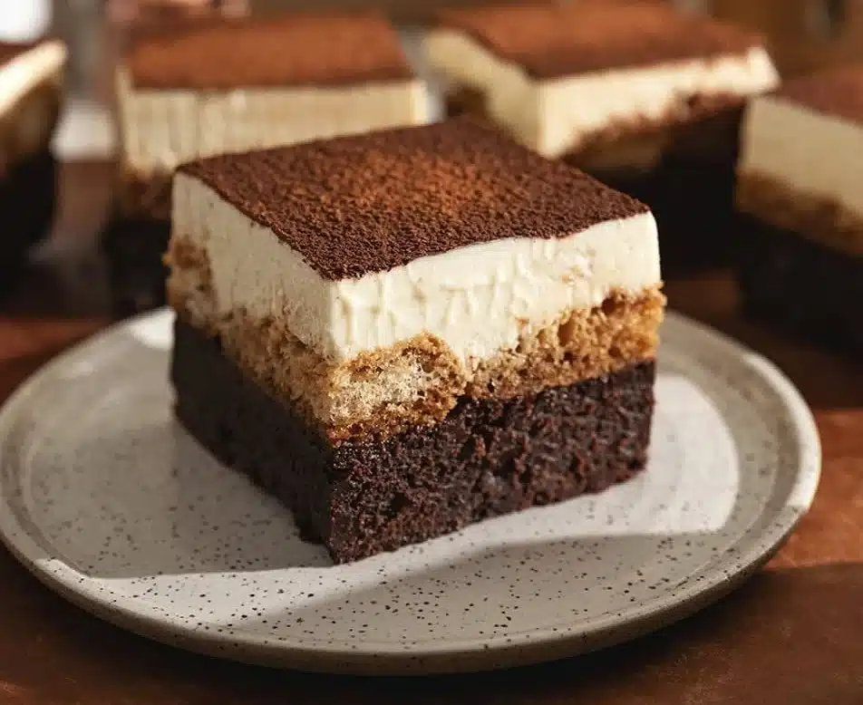 Delicious tiramisu brownies topped with cocoa powder and coffee flavor